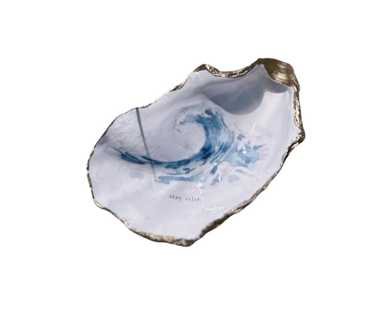 Oyster shell jewelry tray with a natural, wavy design.