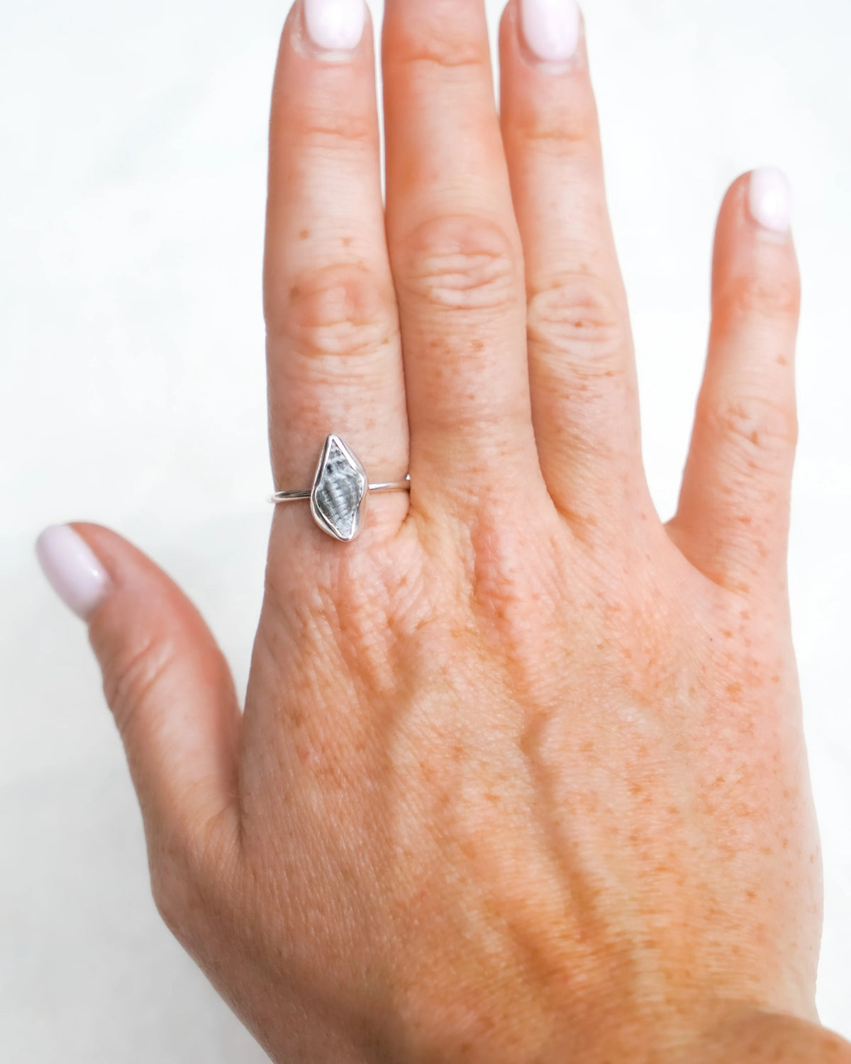Conch shell-inspired resin ring size Q