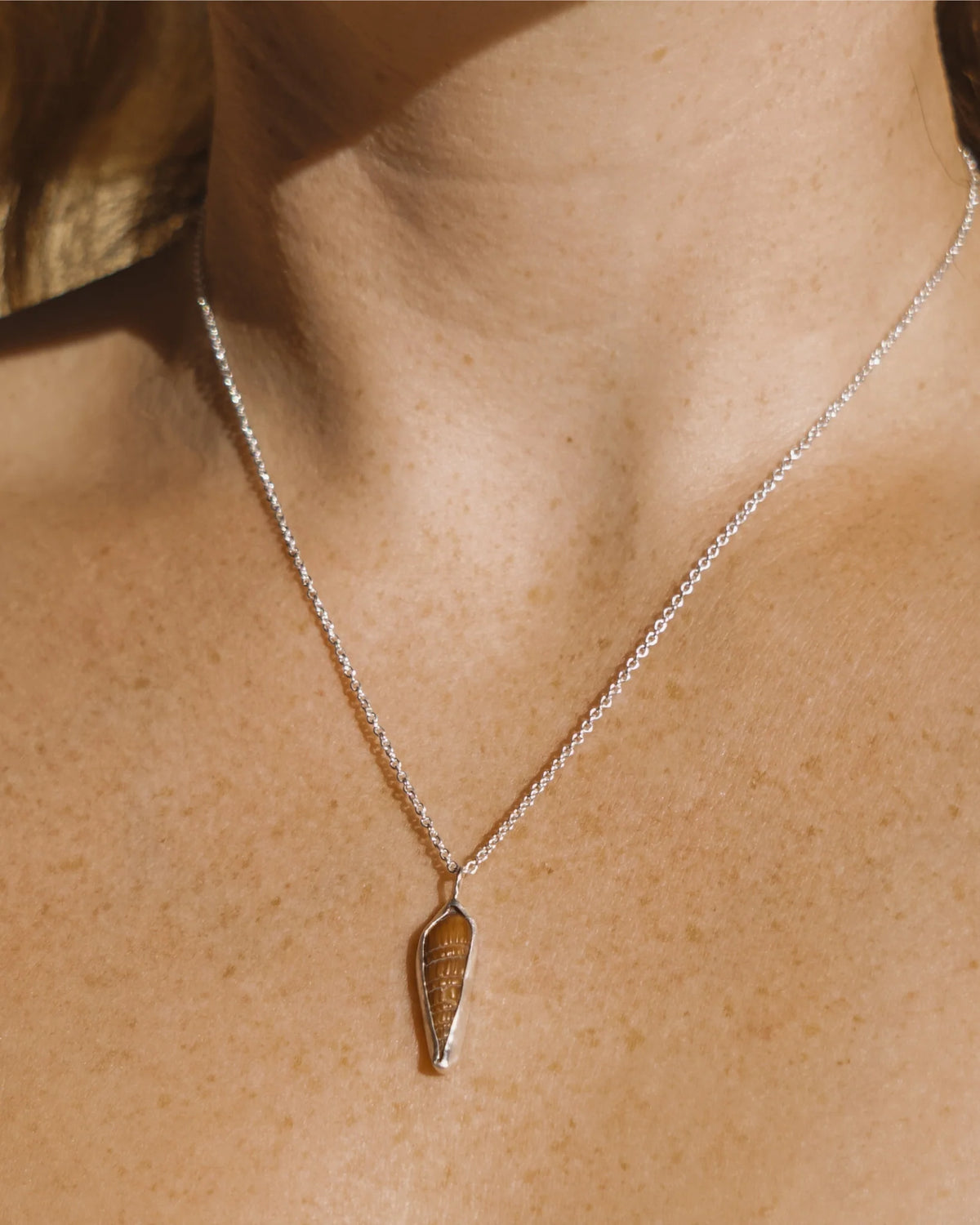 Minimalist natural shell necklace with gold-tone chain
